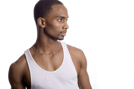 a muscular model is posing against white backgroundの写真素材