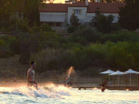 Light Reflection on The Sea during sunset and swimmers in Mediterranean Greece July 6th 2021のeditorial素材