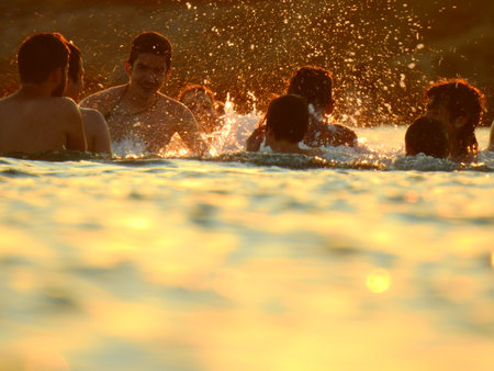 Young guys are playing on the Beach during sunset in Mediterranean near Athens Greece July 8 2021のeditorial素材