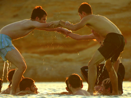 Young guys are playing on the Beach during sunset in Mediterranean near Athens Greece July 8 2021のeditorial素材