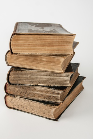Old books stacked in a pileの写真素材