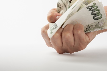 crumpled money in handの写真素材