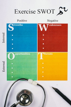Exercise SWOT form sheet, stethoscope and pen on light background. Flat layの写真素材