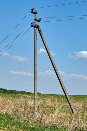 columns electrical power lines on natural backgroundの写真素材