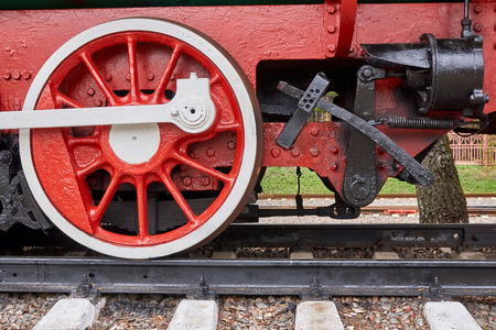 Steel wheels old steam locomotive standing on rails, vintage train, close-upの写真素材
