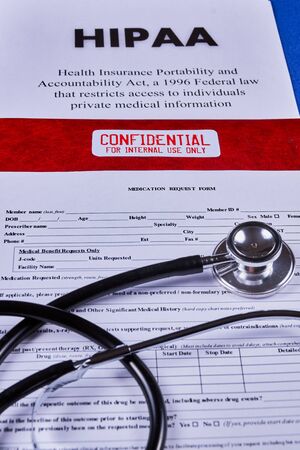 Health Insurance Portability and accountability act HIPAA, red folder with inscription confidential,...