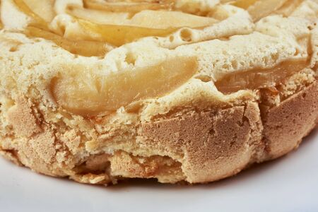 Baked apple pie in a white plate. Close-up