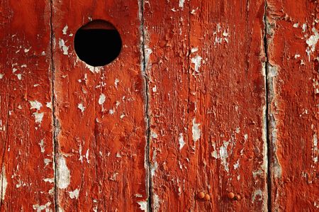 Door with a peep hole painted in redの写真素材