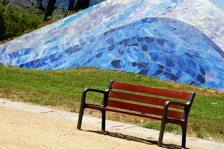 A bench in a barcelonian parkの写真素材