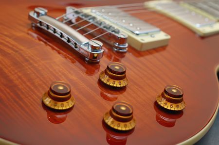 Knob focus on a Les Paul guitar body