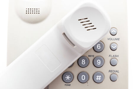 Office phone with cord isolated on white background