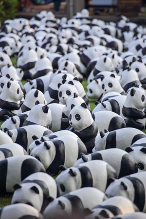 Bangkok, Thailand - March 12, 2016 : 1600 Pandas World Tour in Thailand by WWF at Santichai Prakan Park. 1600 paper marche pandas are made from recycled materials to represent 1600 pandas left in the wild.のeditorial素材