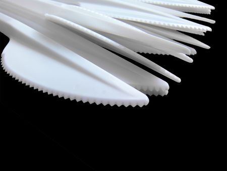 Plastic knives closeup, isolatedの写真素材