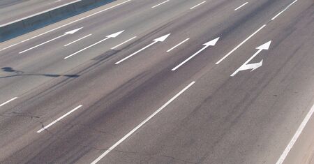 Arrow marks on a roadの写真素材