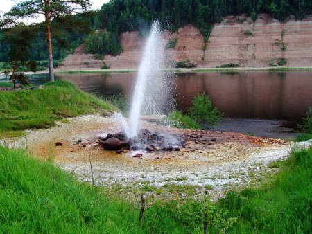 A natural fountain powered by underground forcesの写真素材