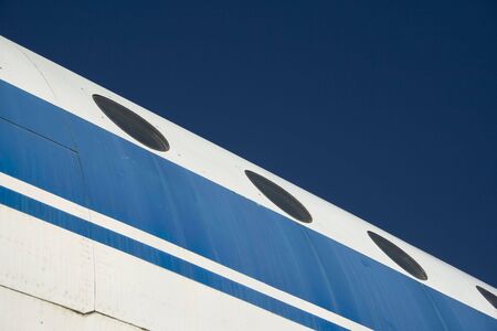 An outside view of a plane over a blue skyの写真素材
