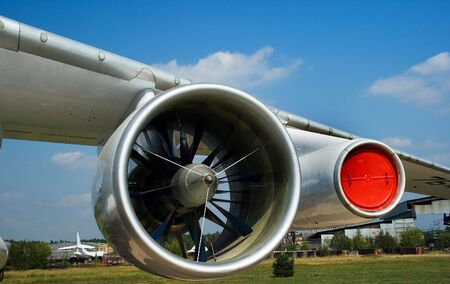 The wing of a turboreactive plane stationed on an aerodromeの写真素材
