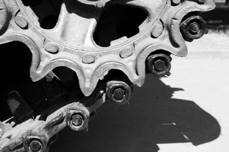 A closeup of tracks of an old military vehicleの写真素材