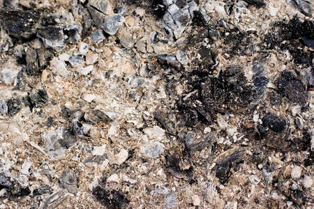 Close view of ash from wood burning as a background textureの写真素材