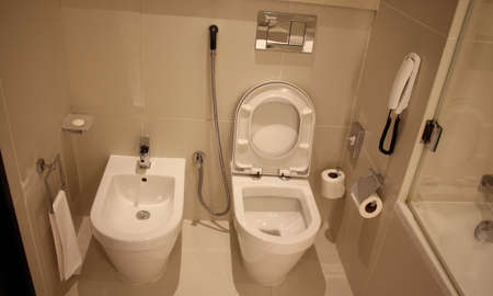 A generic hotel bathroom toilet view