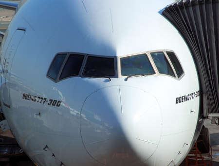 A close view of a Boeing 777 plane docked in an airport in Dubai, february 2015のeditorial素材