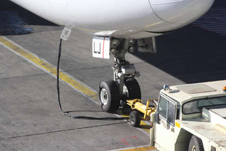 Fore carriage of a modern airplane on asphalt in an airportの写真素材