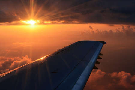 An overwing view of a nice sunset and beautiful skiesの写真素材