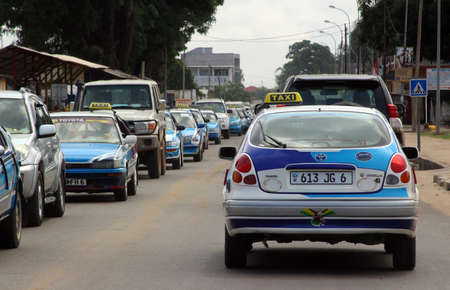 A car jam with colorful taxi cars in Pointe-Noire, Congo Republic, february 2015のeditorial素材