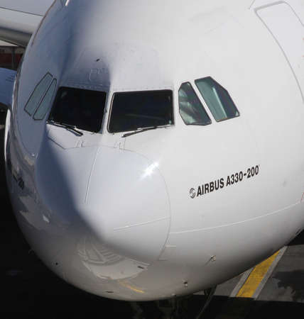An Airbus A330-200 plane front view docked in an airportのeditorial素材
