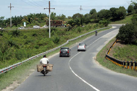 Roads and car traffic in central Indonesia in Riau, november 2013のeditorial素材