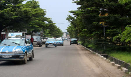 City roads view and colorful painted taxi cars in Pointe-Noire, Congo Republic, february 2015のeditorial素材