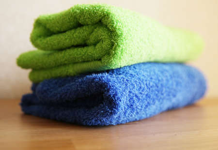 Close view of two towels on a wooden tableの写真素材