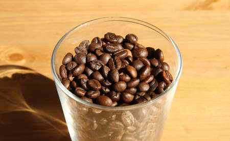 Close view of a glass fulled with coffee beansの写真素材