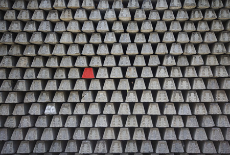 Stacked concrete railway sleepers , Railway sleepers background. with the red one