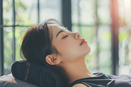 Young Asian woman sleeping on massage bedの素材