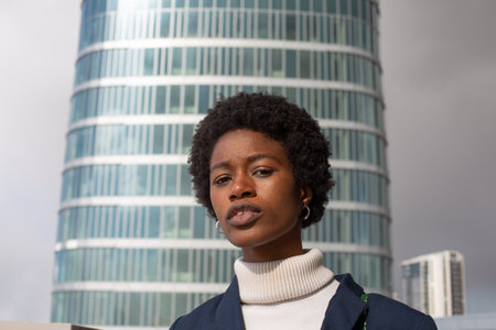 Portrait of a beautiful young african american woman in the cityの写真素材