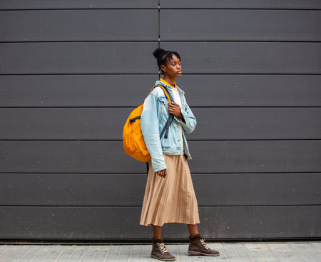 Fashionable woman poses outside Gucci fashion show building for Milan Women's Fashion Week  in Milan.の写真素材