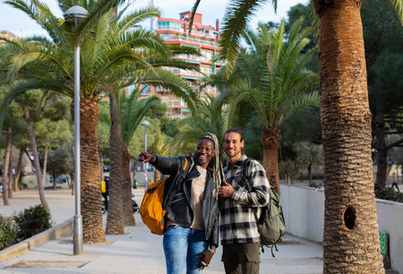 Two afro-american friends walking in the streets of Barcelonaの写真素材