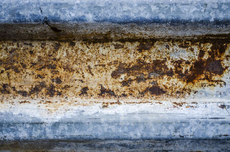 Grunge texture rusty fence and rust stains yellow with blue