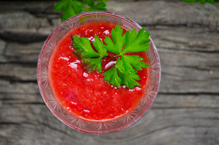 Fresh strawberry  crushed  with mint on a green background with a Board  texture の写真素材