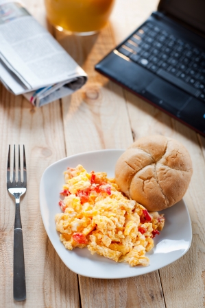 Scrambled eggs for breakfast at workの写真素材
