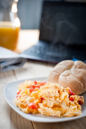Scrambled eggs for breakfast at workの写真素材