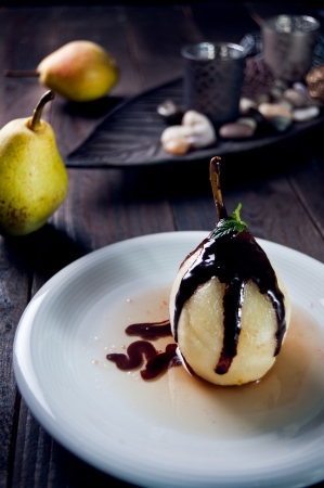 Delicious pear dessert with chocolate and amaretto liqueurの写真素材