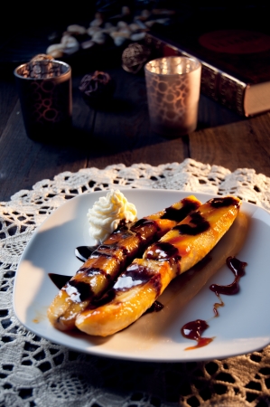fried banana dessert with hot chocolateの写真素材