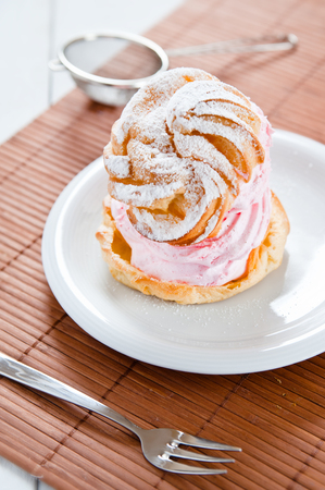 Delicate puff profiterole filled with delicious creamの写真素材