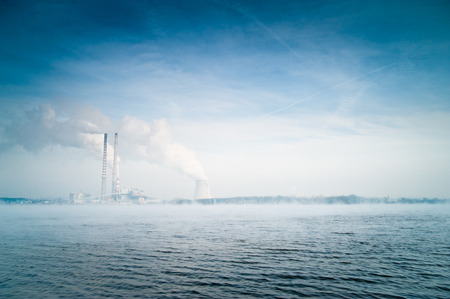 Natural landscape with power plant on background