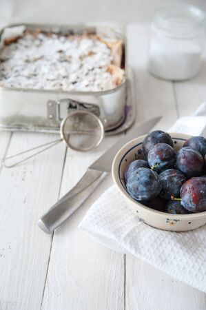 Preparing plums for cakeの写真素材