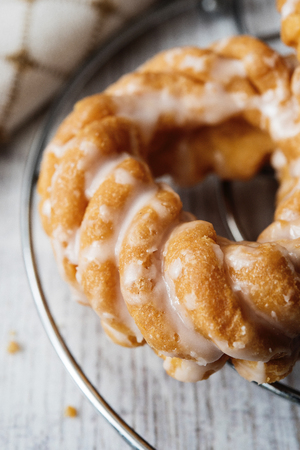 Sweet donuts with icing on wooden backgroundの写真素材