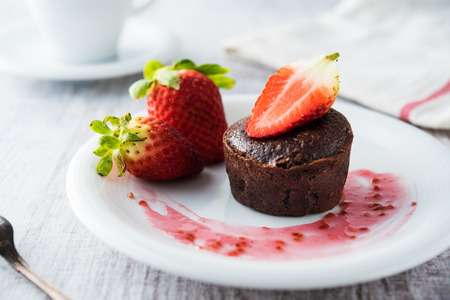 Chocolate souffle with strawberriesの写真素材