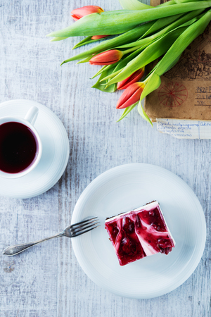 Delicious and sweet cheesecake with cherry jellyの写真素材